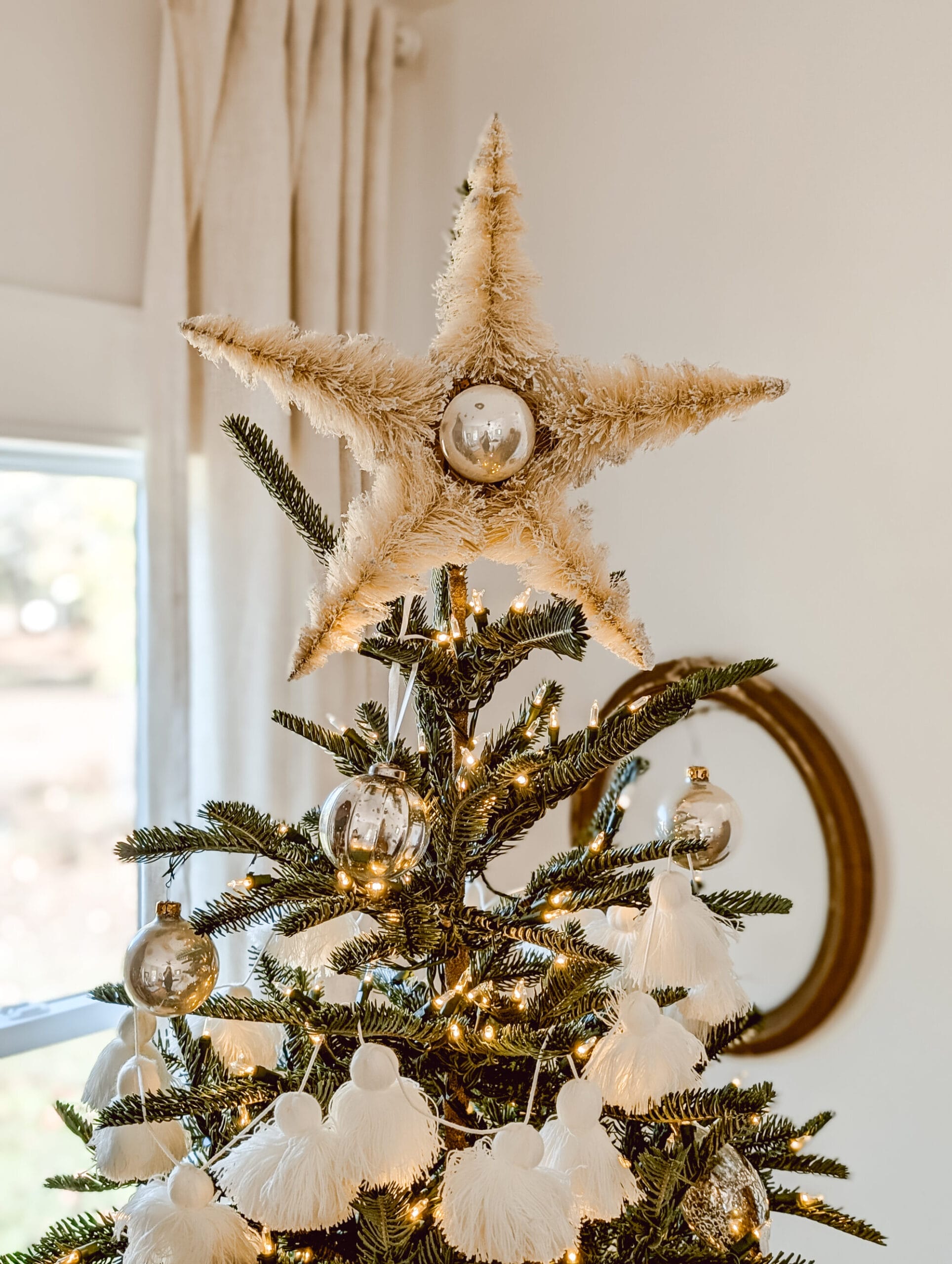 our DIY bottle brush star tree topper on the Nordmann fir Christmas tree