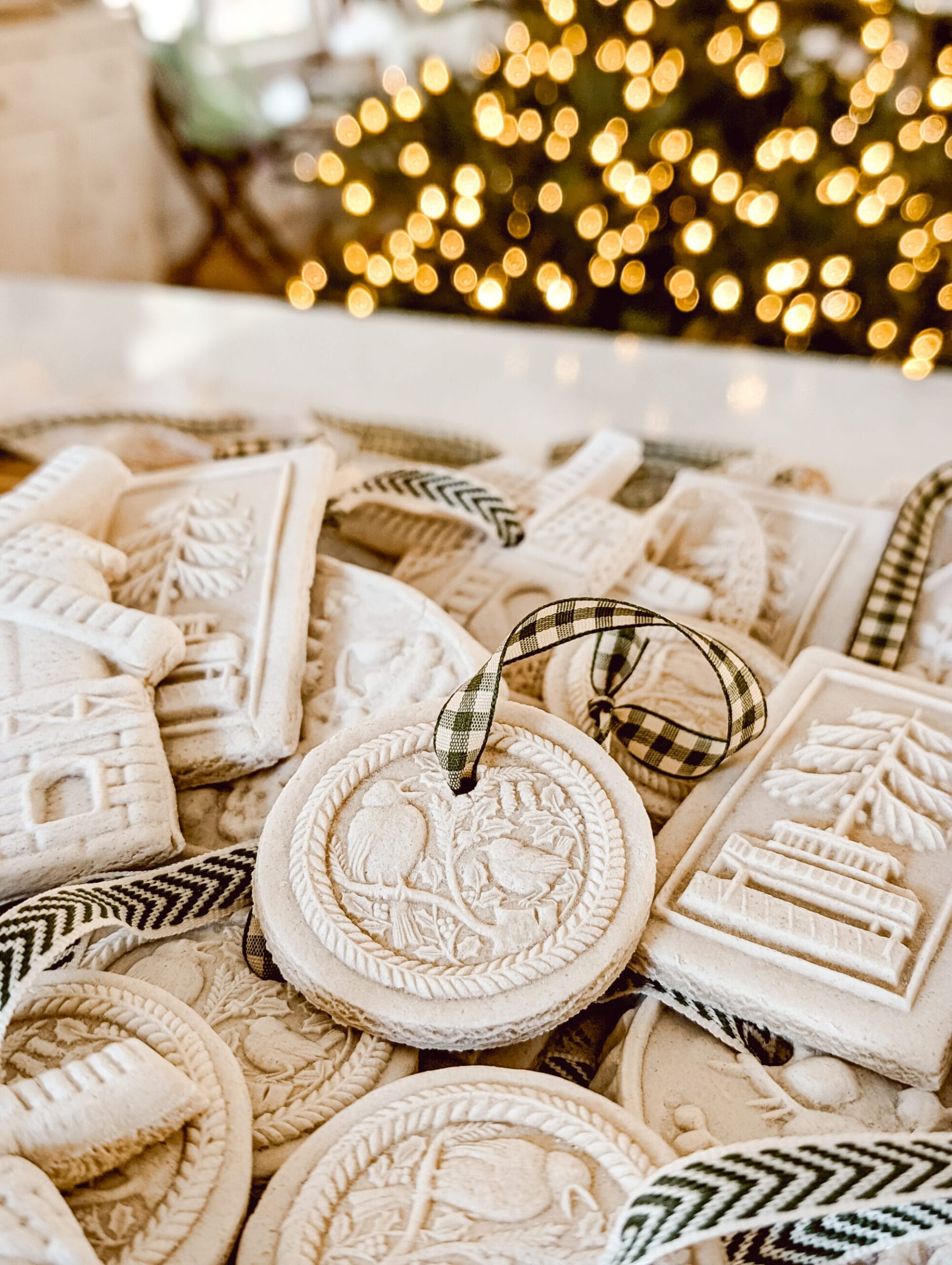 pressed cookie mold salt dough ornaments for Christmas with green and white ribbon hangers