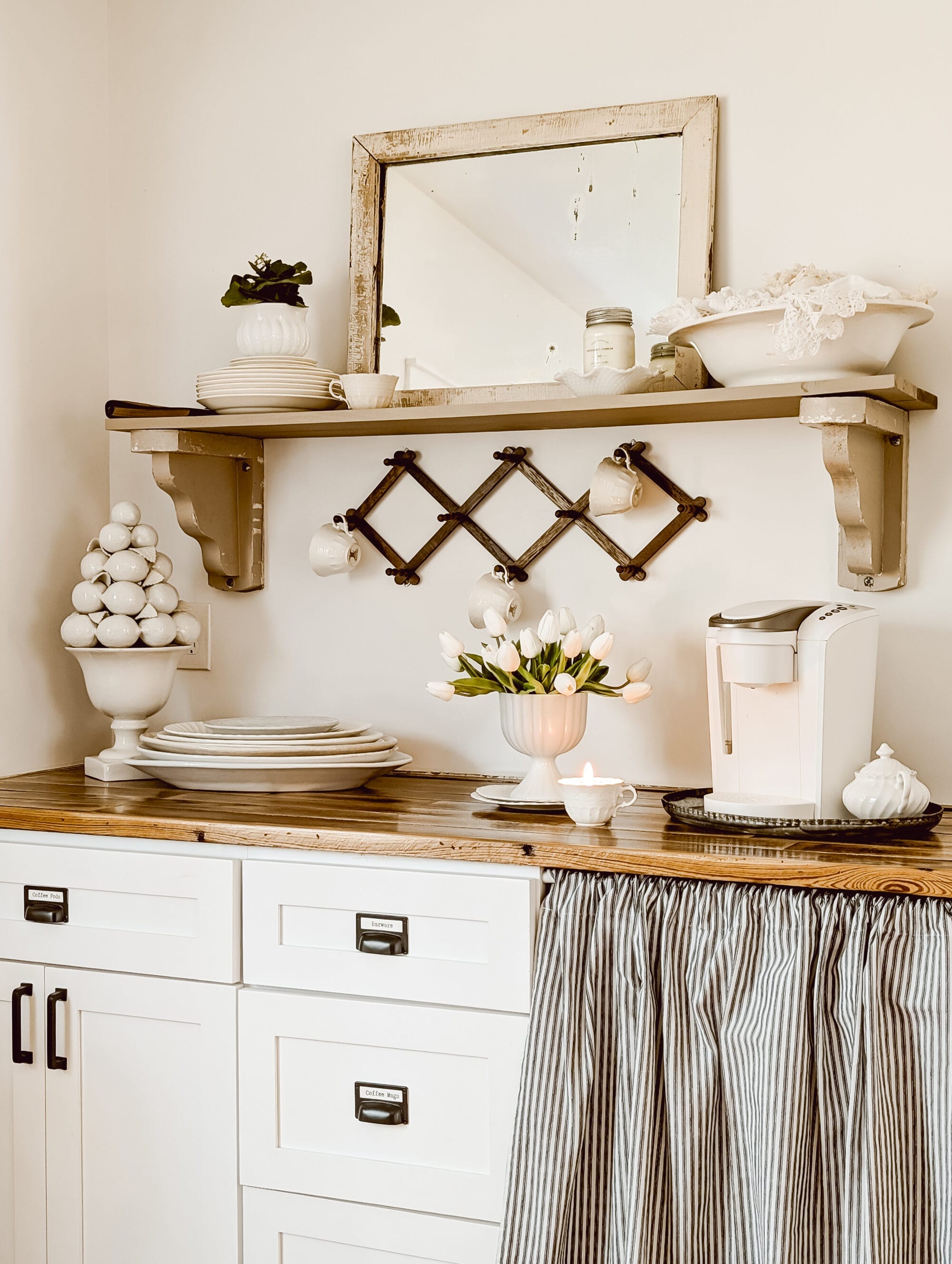 white chippy antique mirror styled on a built in coffee bar shelt