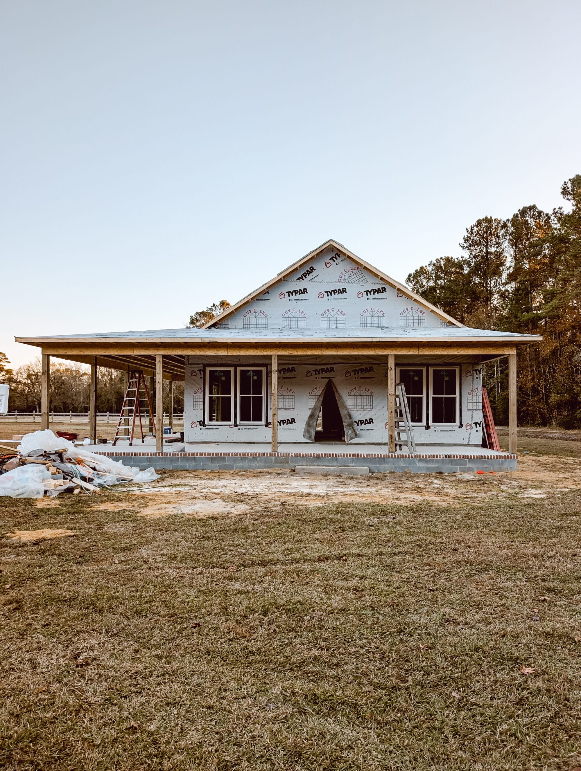cottage construction site after the house has been wrapped with weather proof house wrap