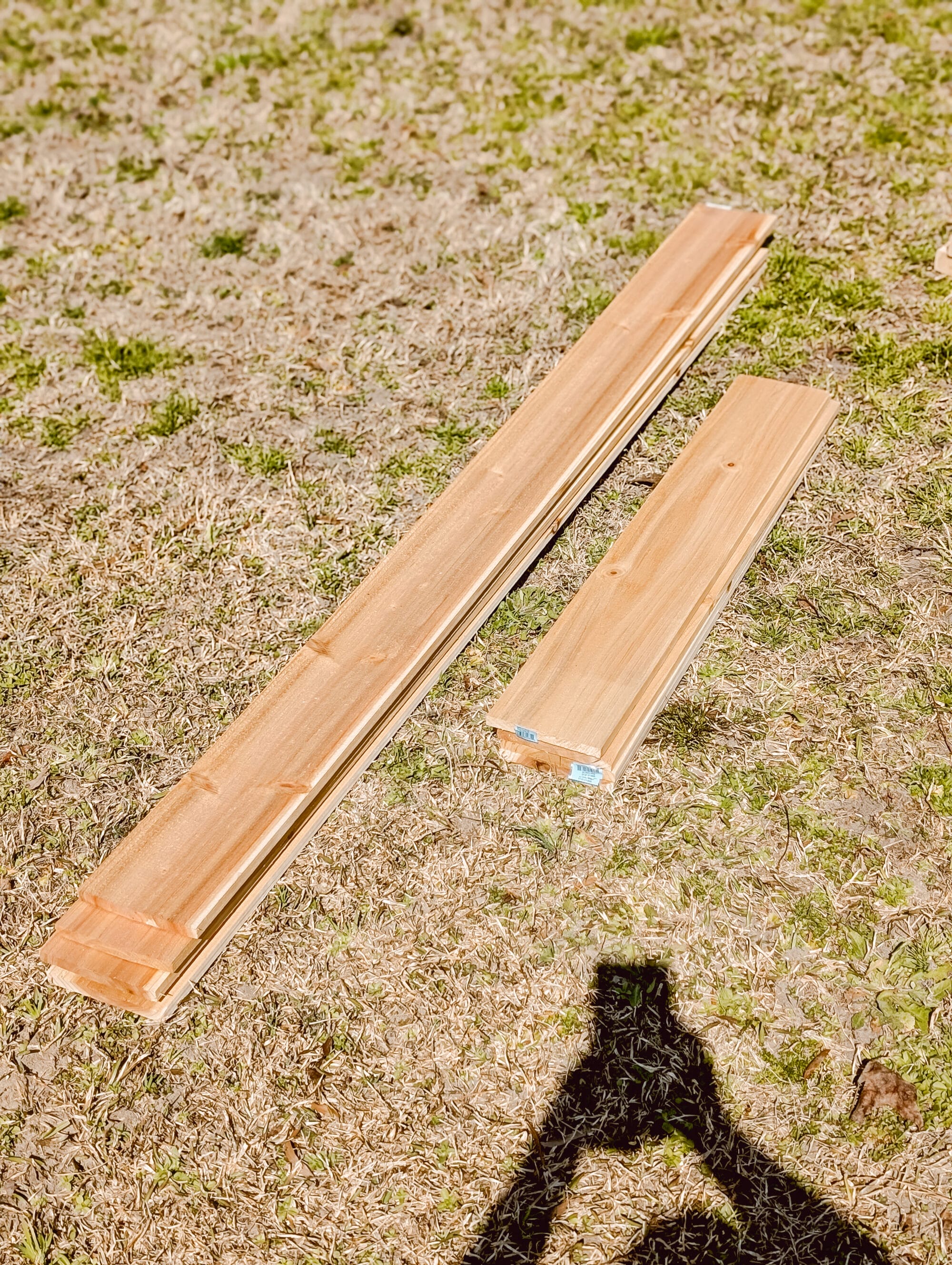 stack of cedar fence pickets cut to make a raised garden bed