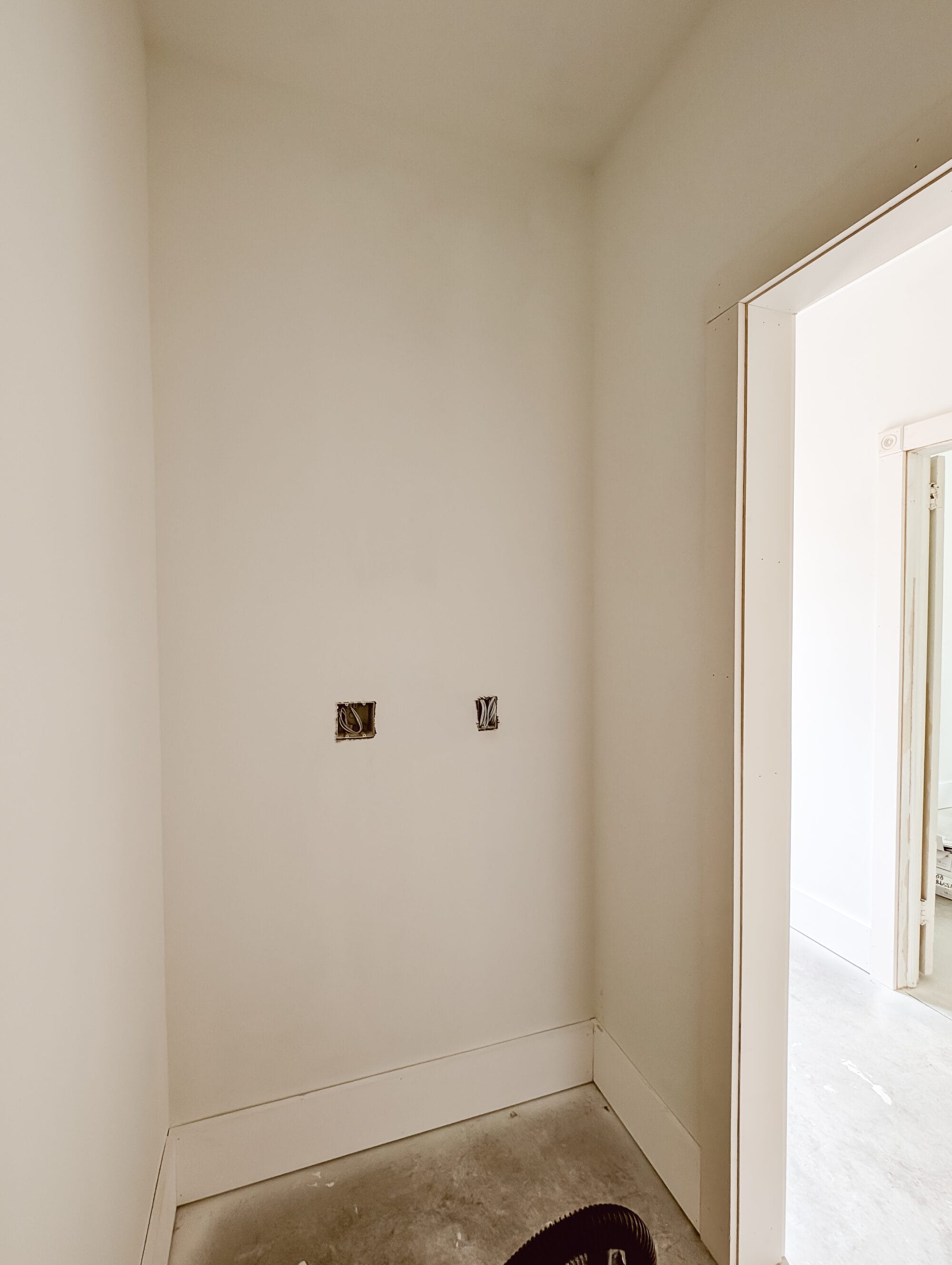 primed pantry walls and concrete subfloors