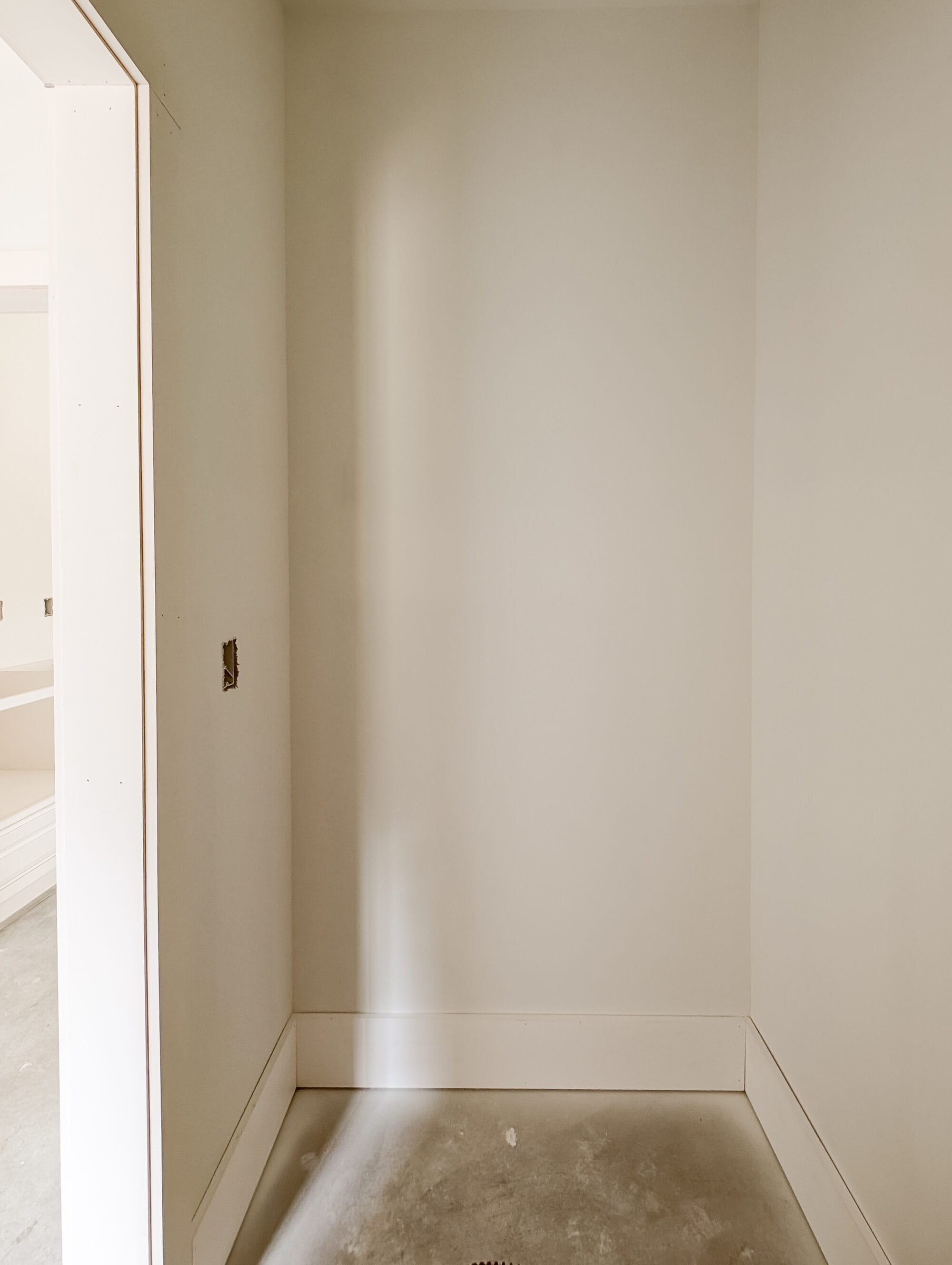 primed pantry walls and concrete subfloors