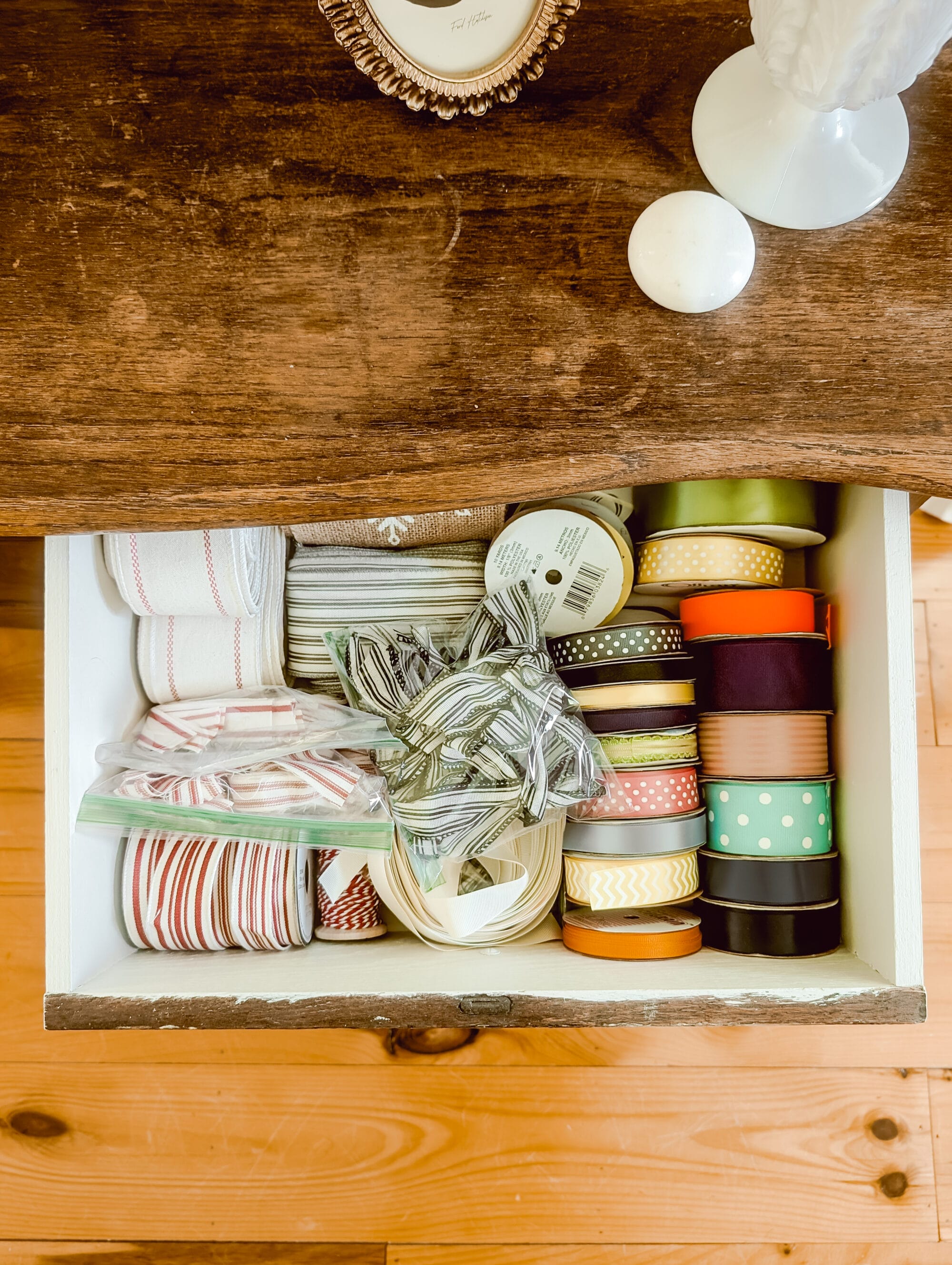 wood dresser with white paint on the interior of the dresser drawers