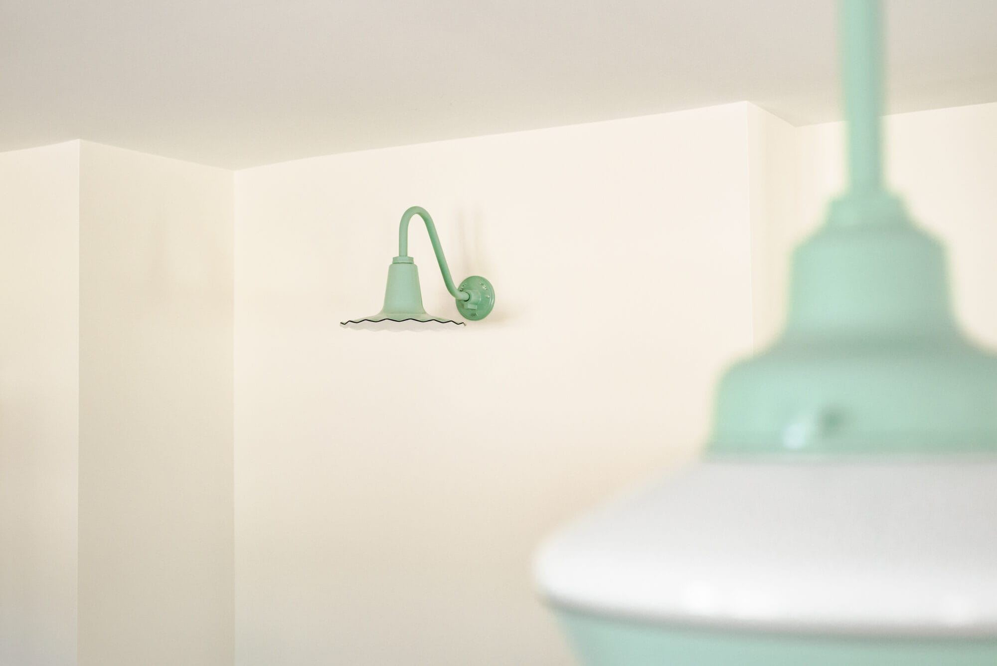 jadeite green seaside sconce light from Barn Light Electric by the fridge wall