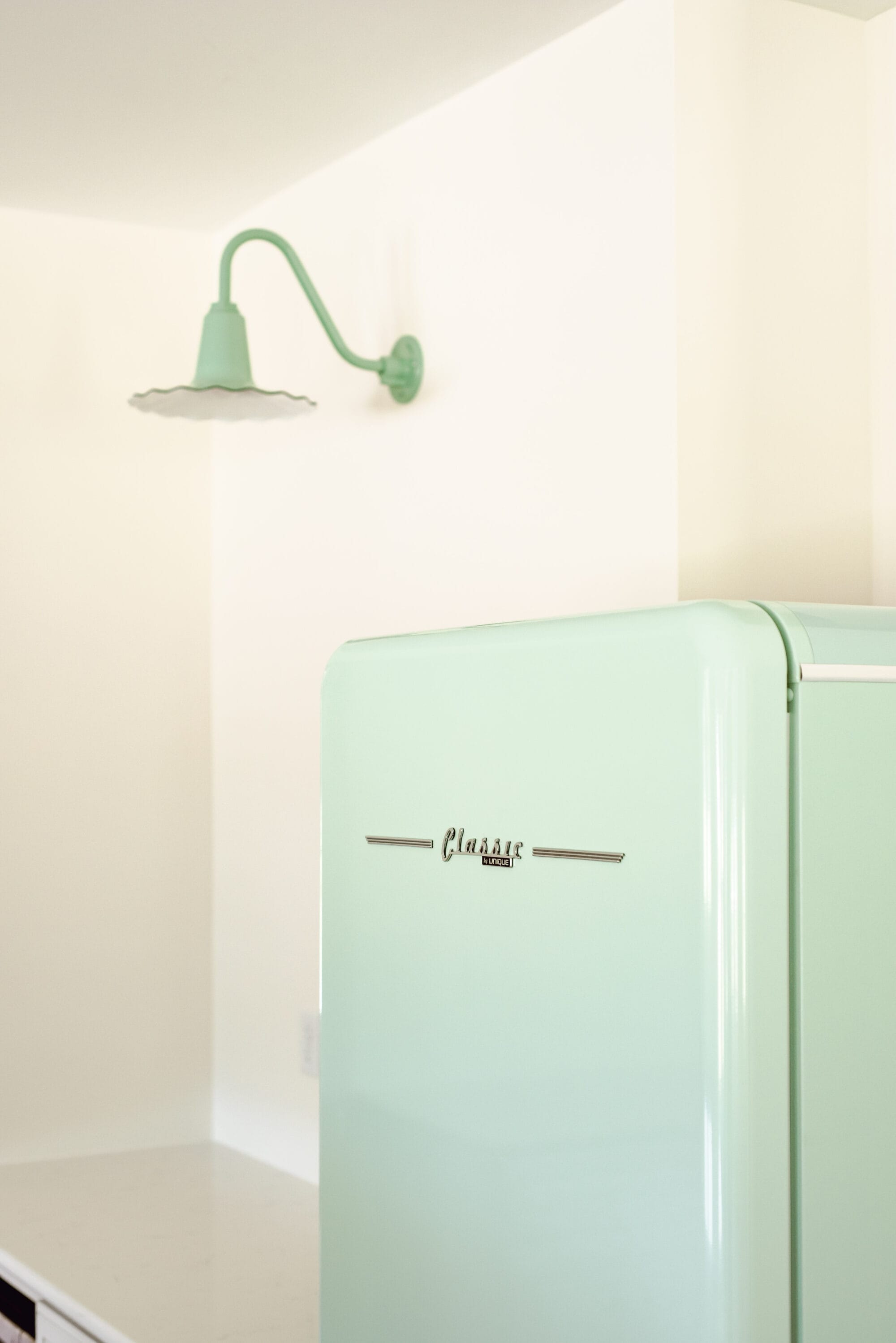 retro style mint green fridge in a new old cottage kitchen