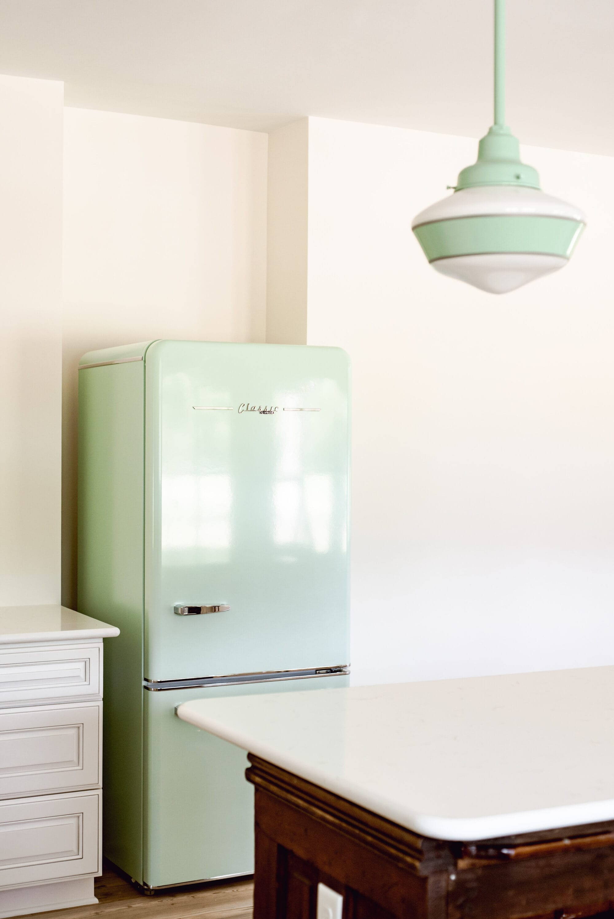 retro style mint green fridge in a new old cottage kitchen