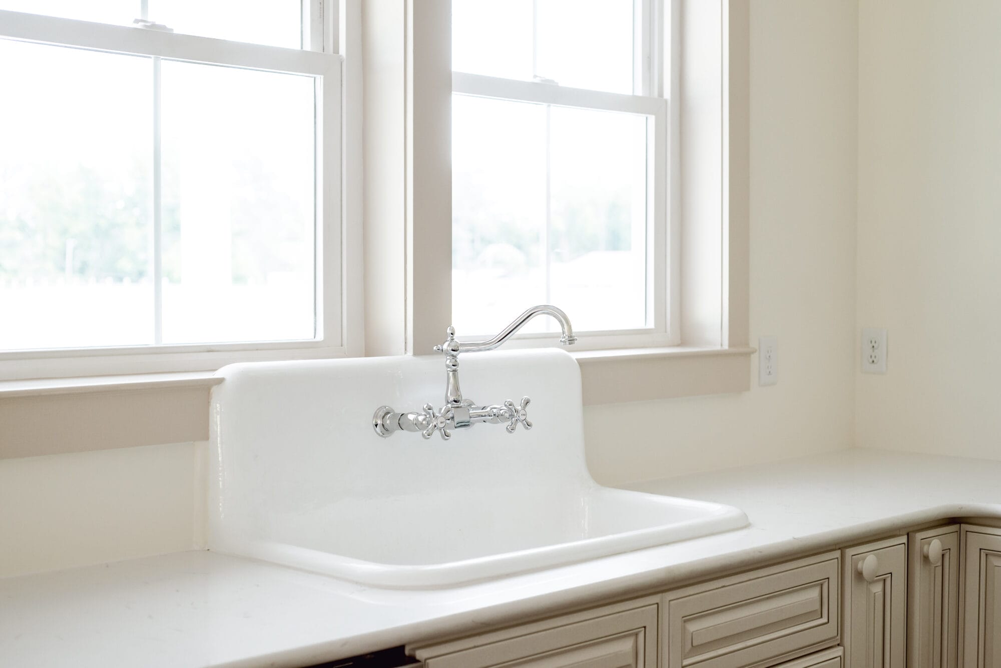 vintage style chrome kitchen faucet with "hot" and "cold" water knobs