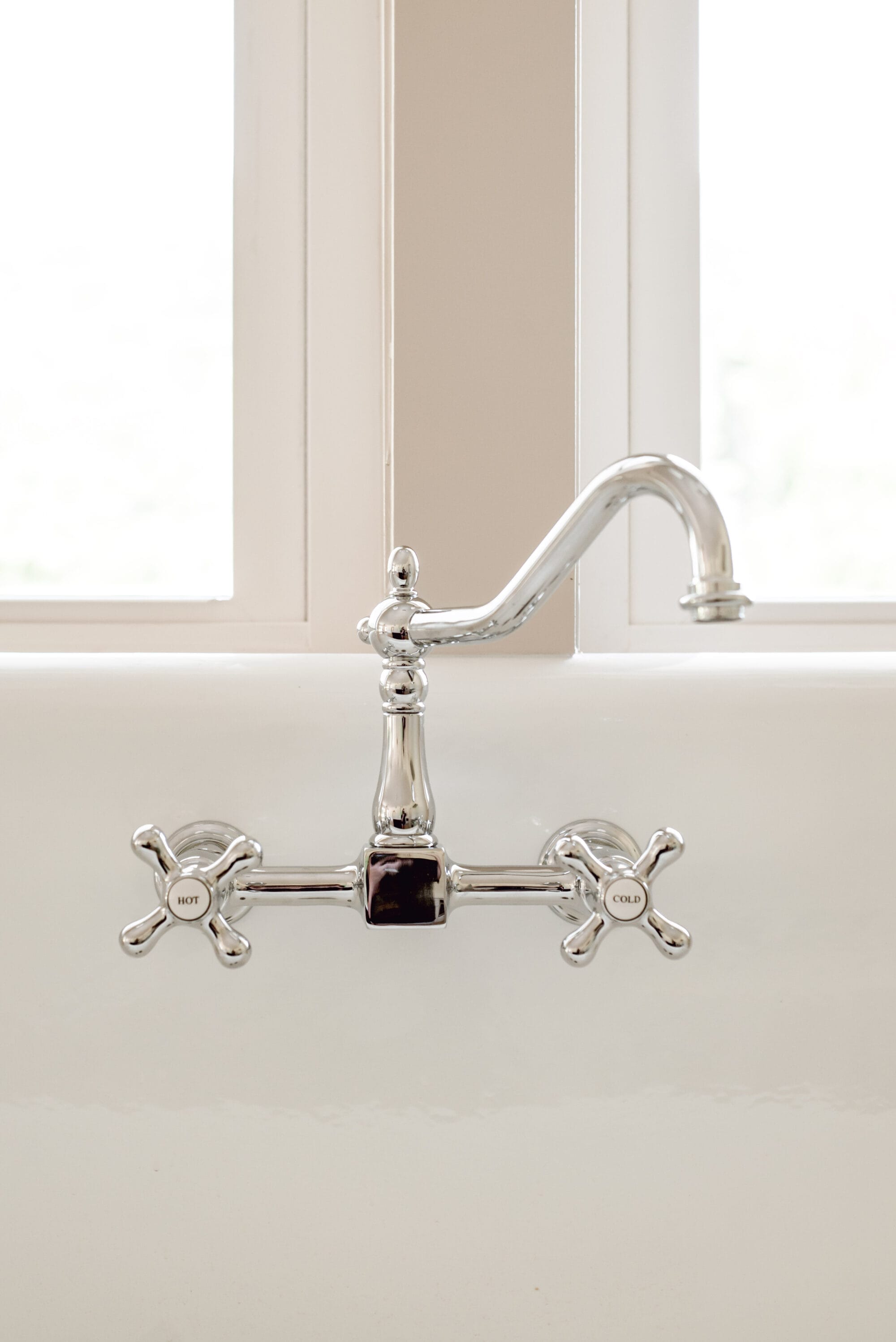 vintage style chrome kitchen faucet with "hot" and "cold" water knobs