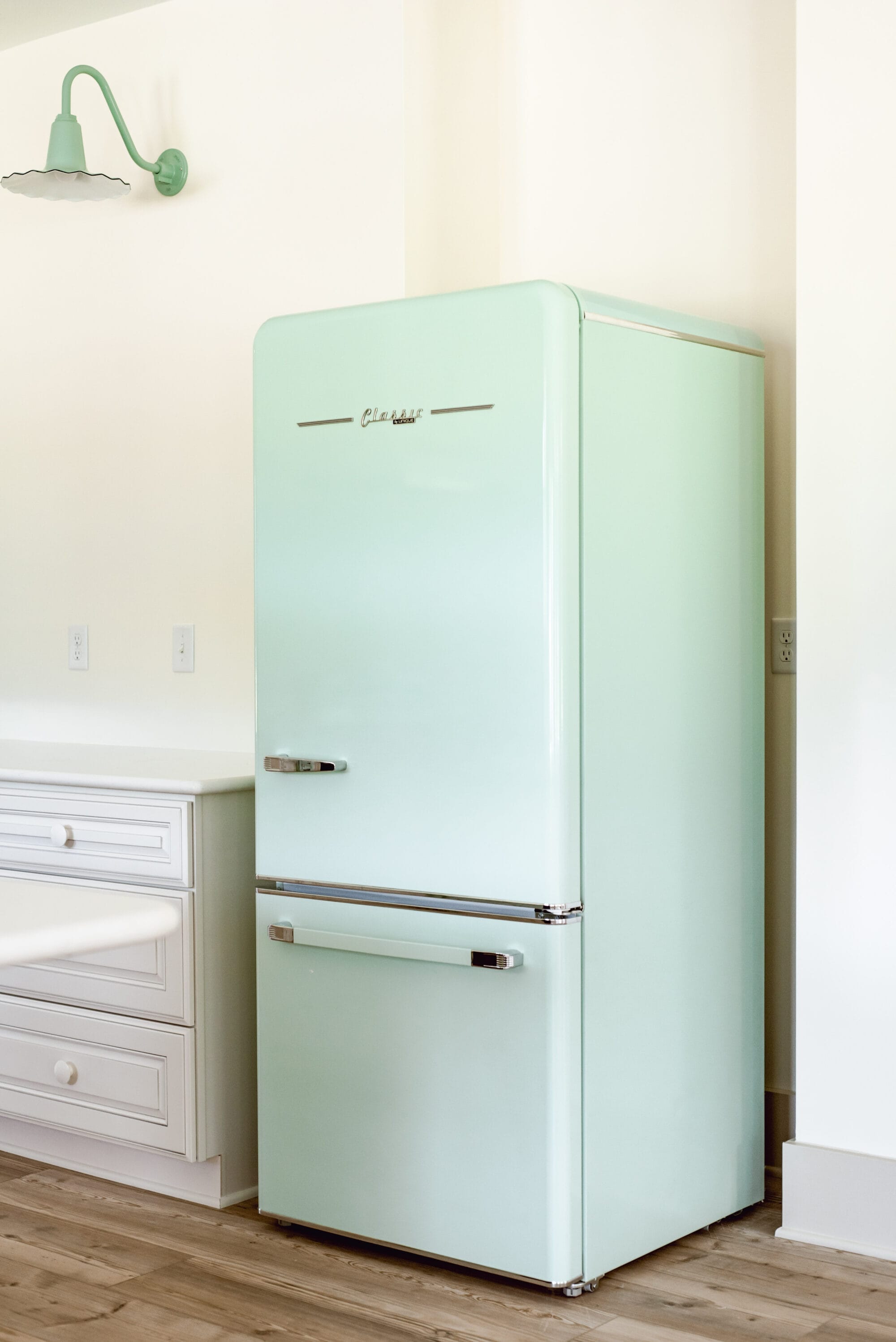 retro style mint green fridge in a new old cottage kitchen