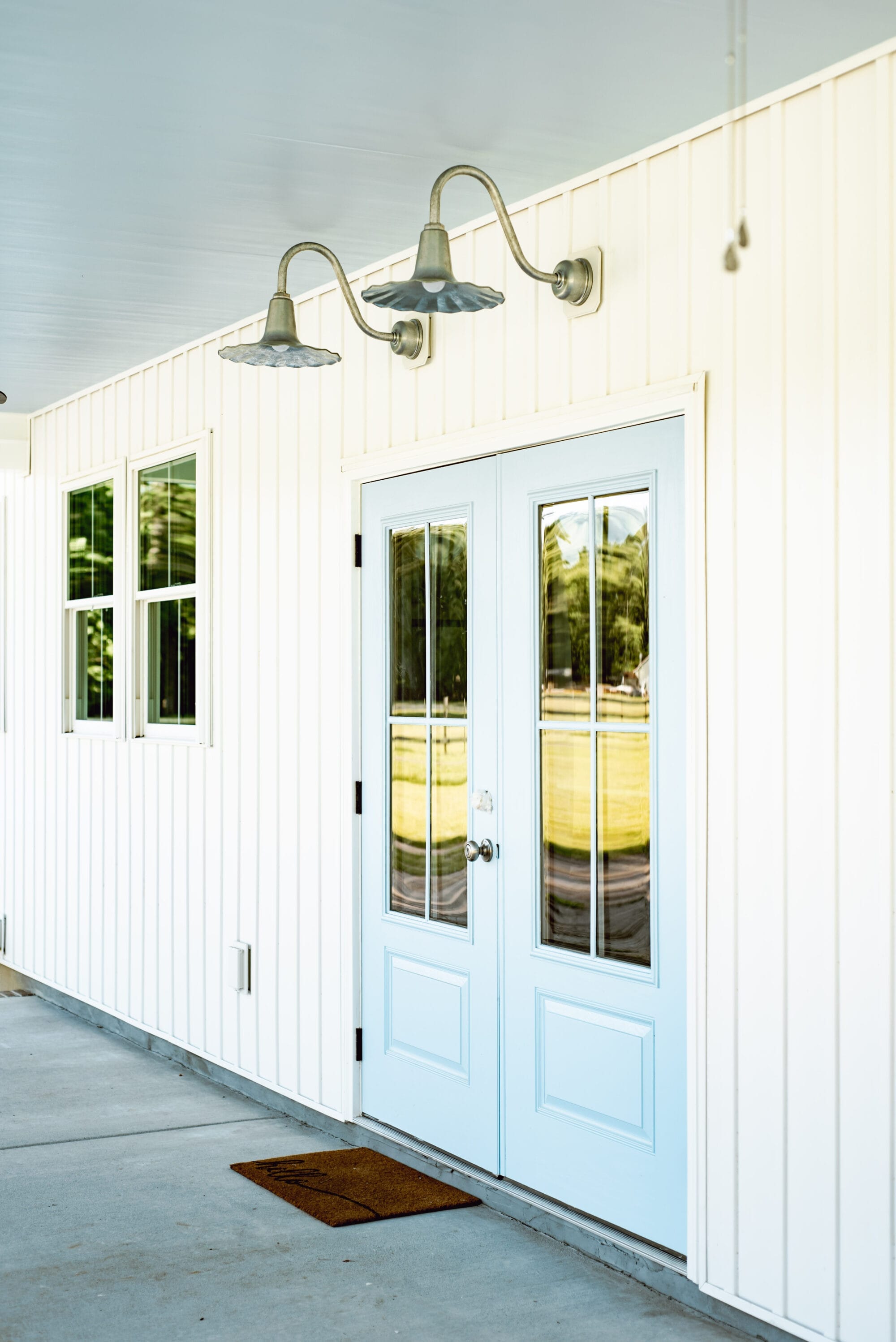 haint blue ceilings and blue doors on a covered cottage porch
