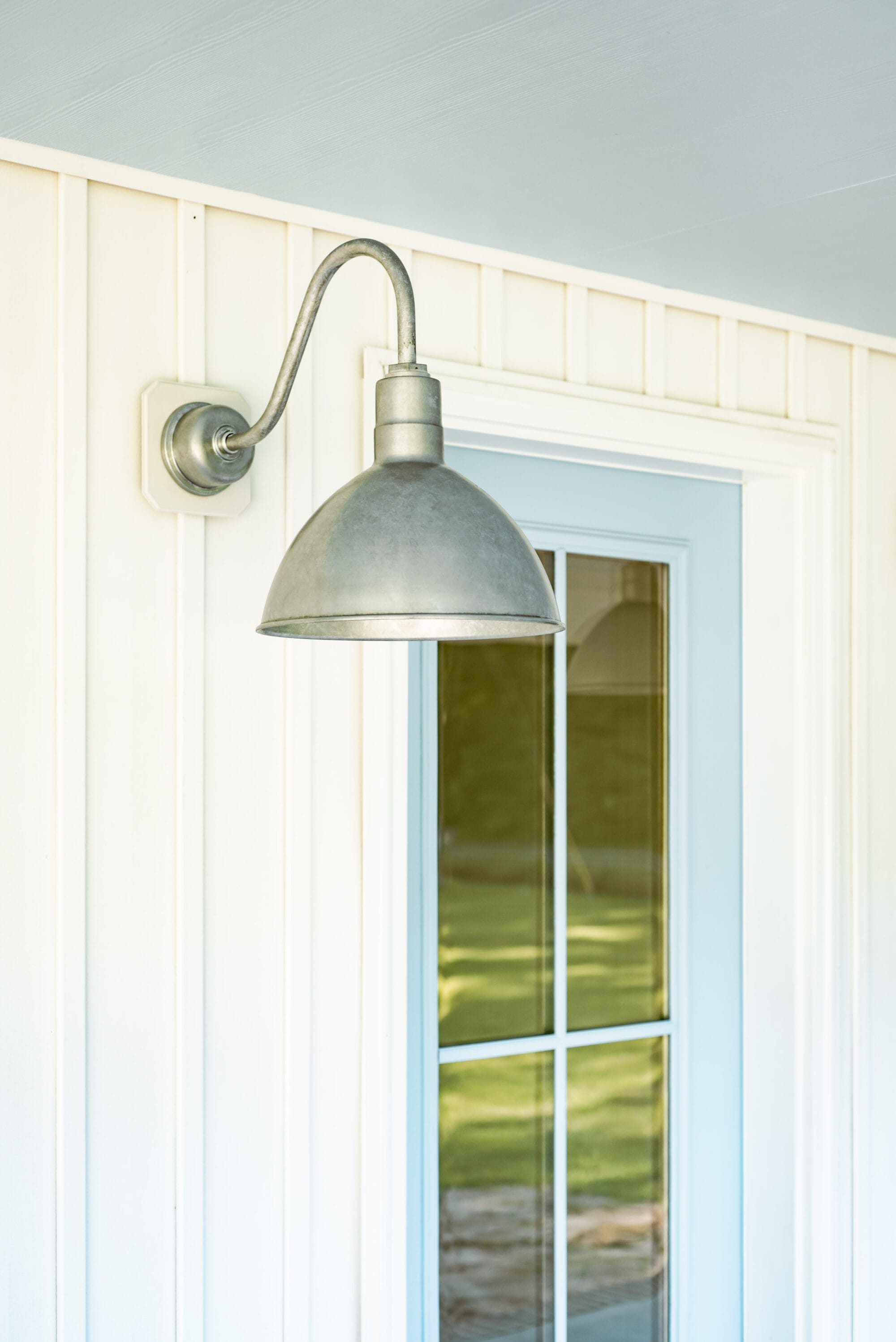 galvanized wilcox deep bowl gooseneck porch lights from Barn Light Electric on a white cottage