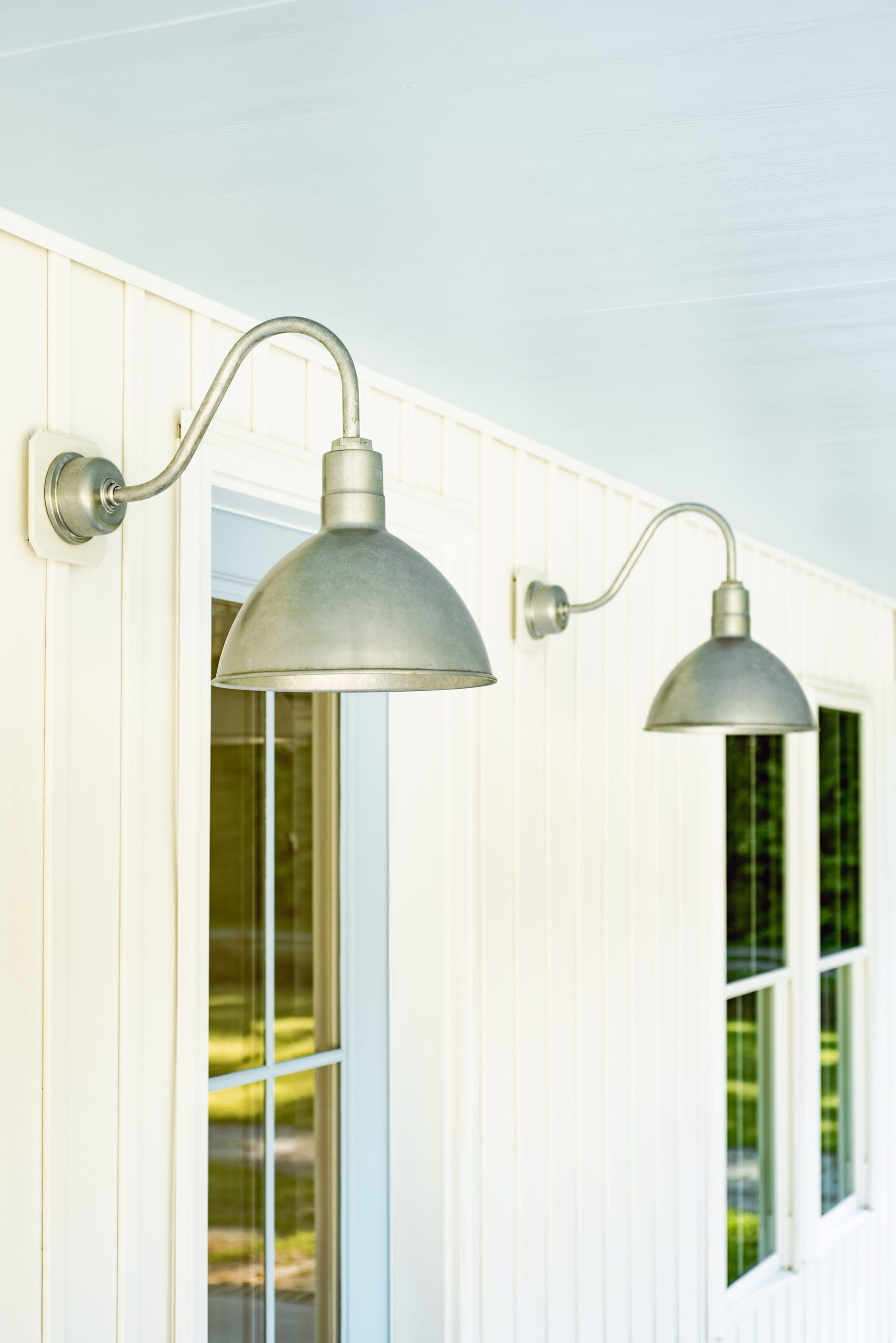 galvanized wilcox deep bowl gooseneck porch lights from Barn Light Electric on a white cottage