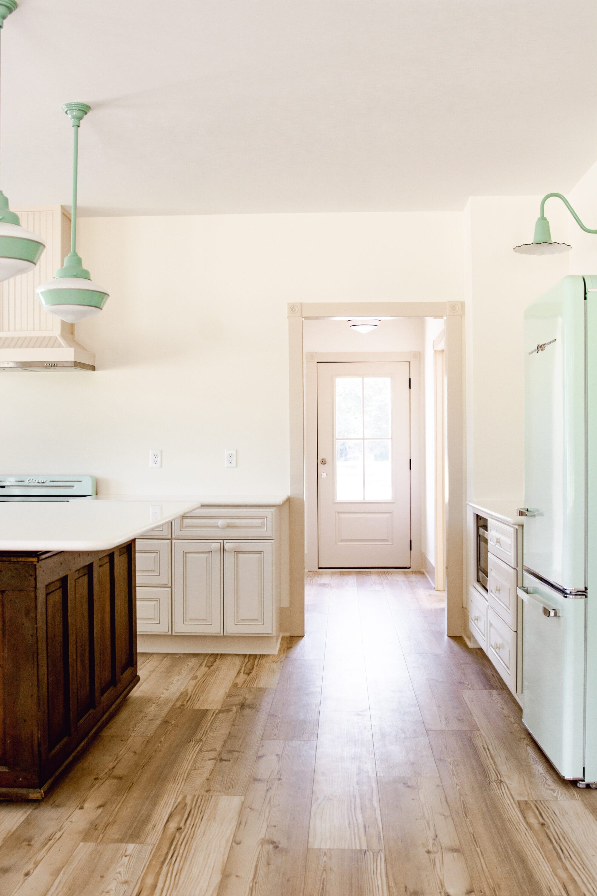 looking through the cottage kitchen towards the back hallway and back door