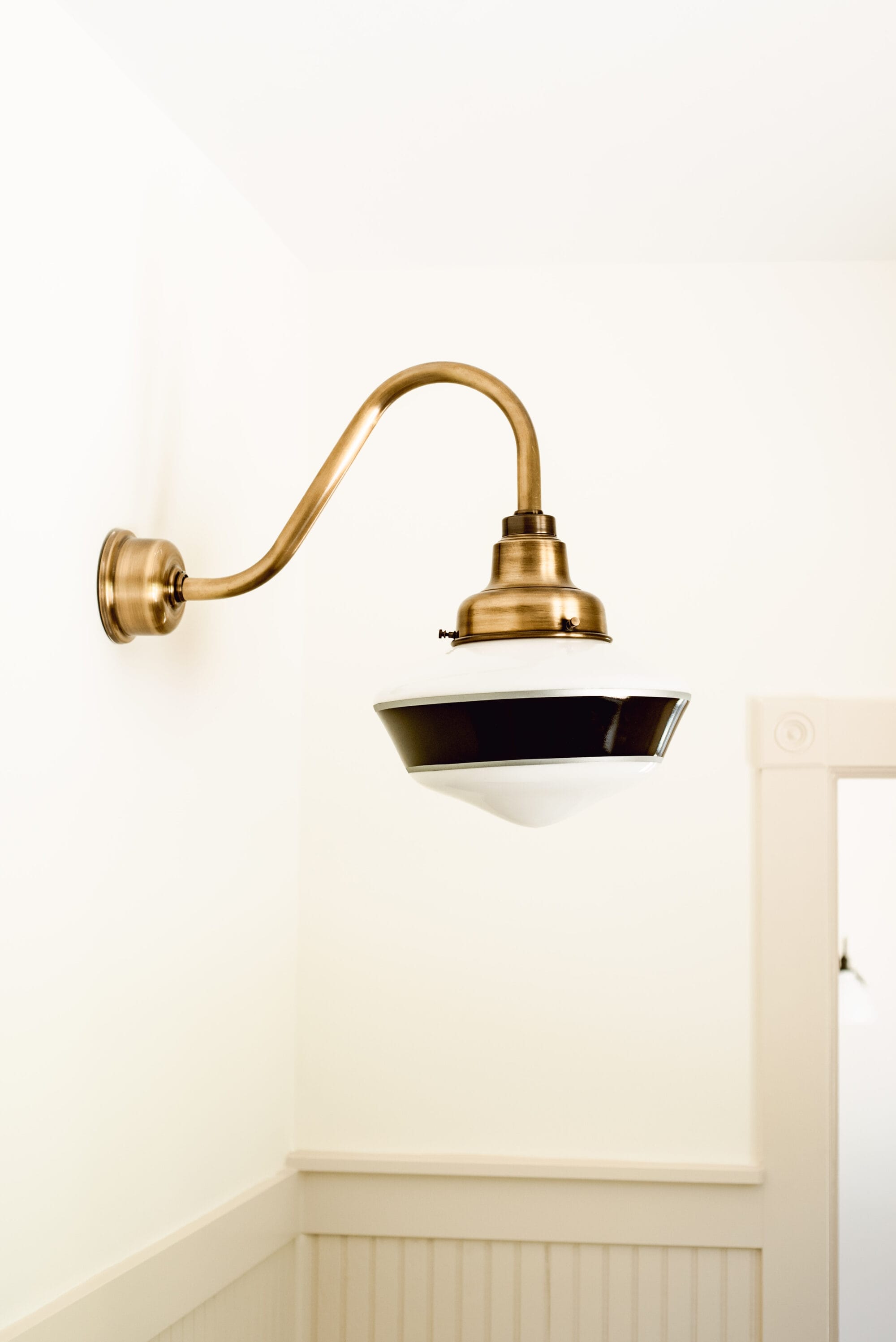 black and white primary schoolhouse globe with brass gooseneck arm from Barn Light Electric