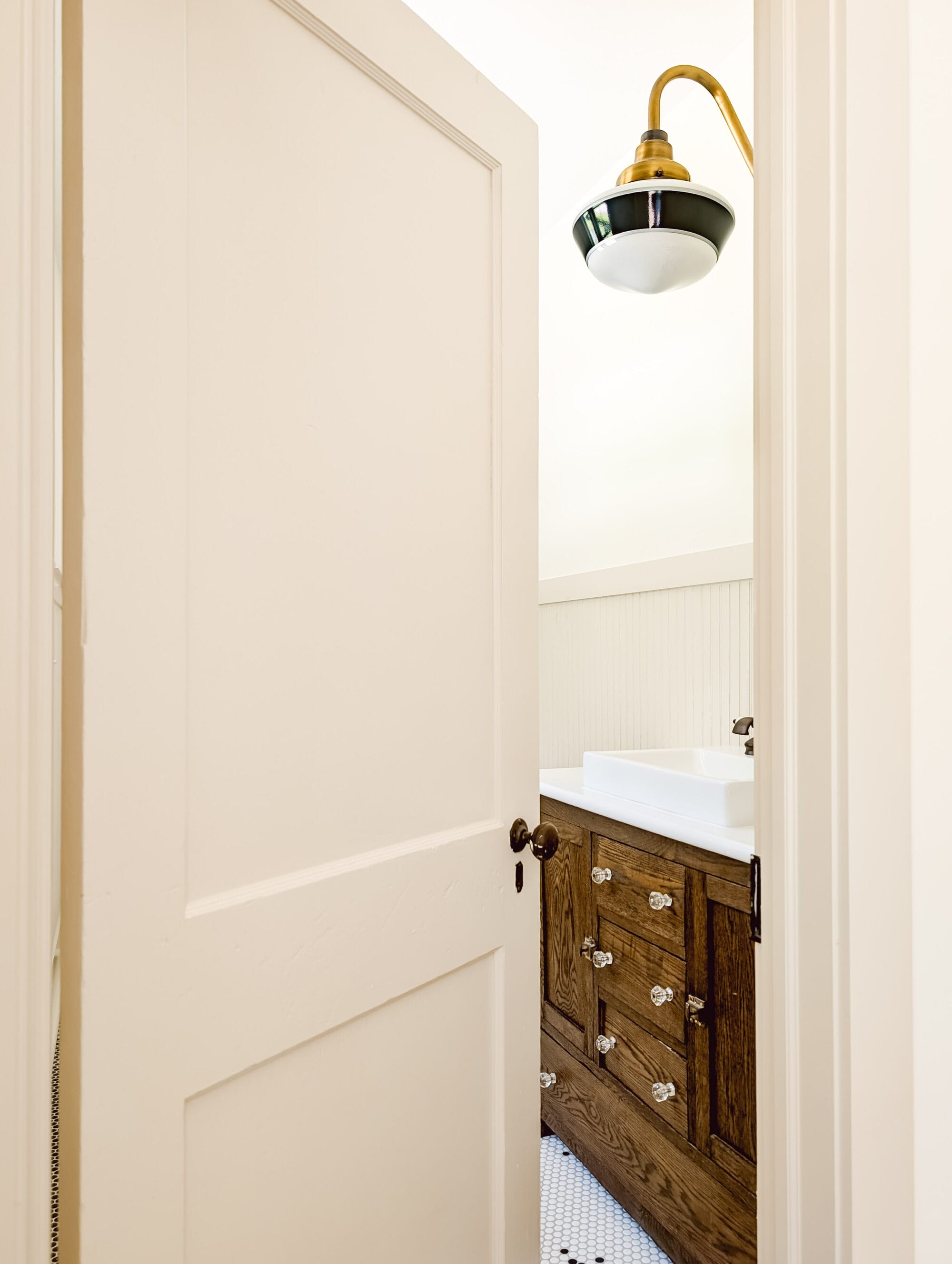 salvaged antique door with original black door knobs