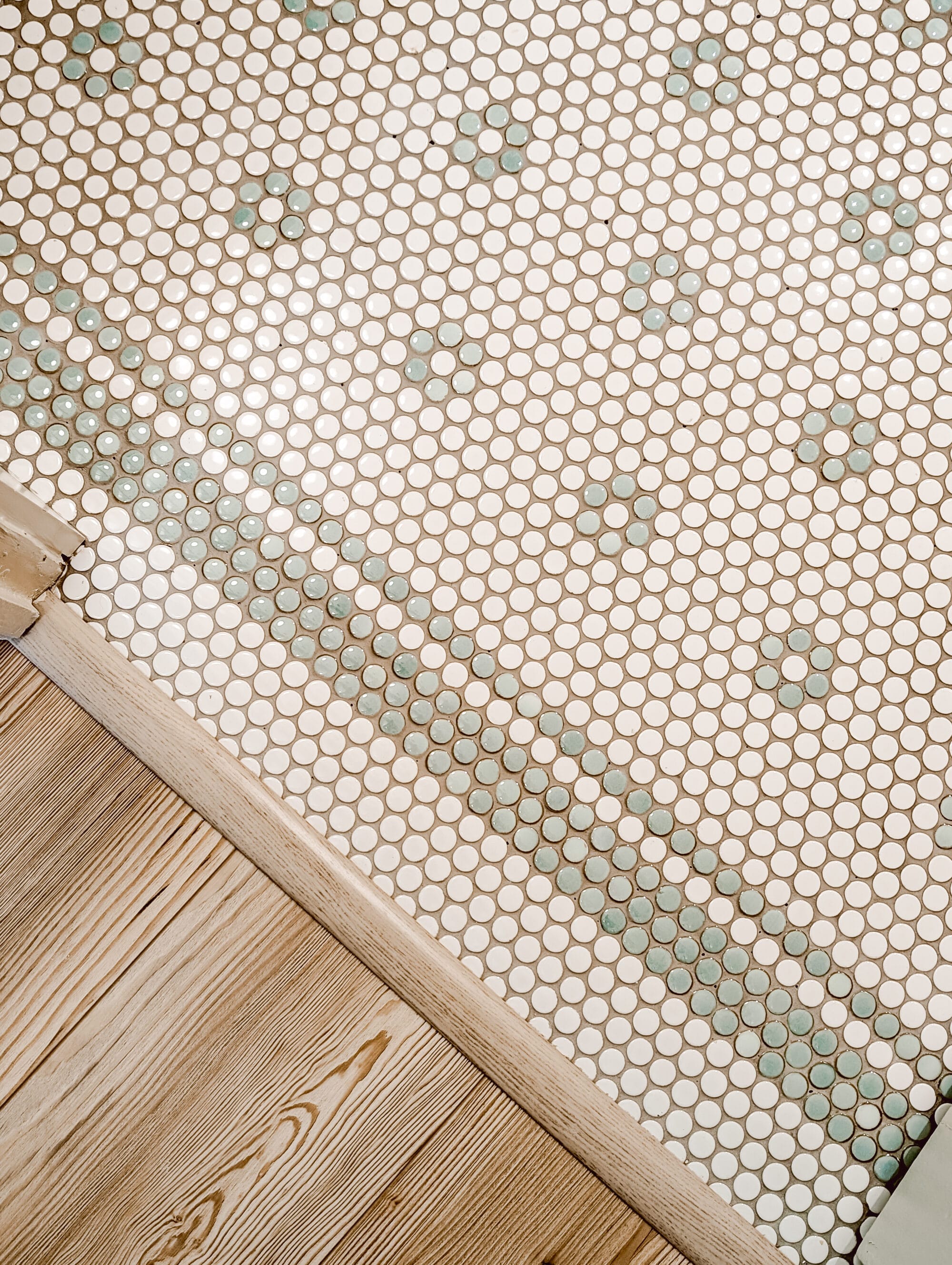 vintage inspired mint green and white penny tile floors in a daisy pattern