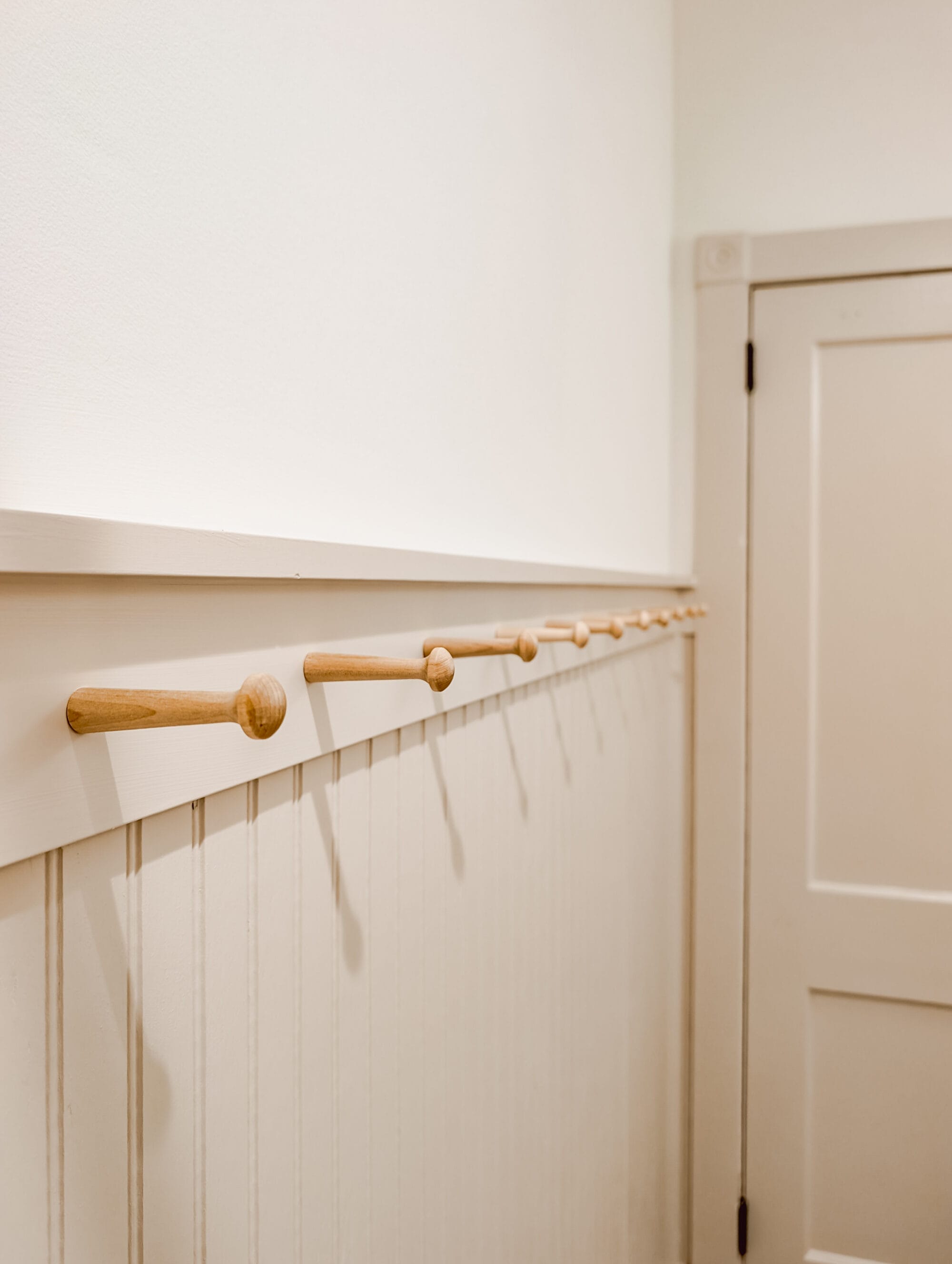 peg hooks for hanging towel storage in a cottage bathroom