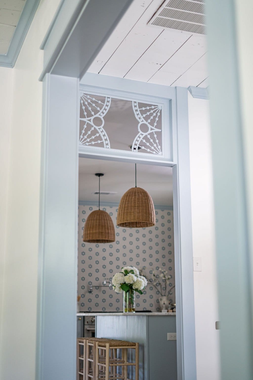 soft blue interior door trim and an antique transom window