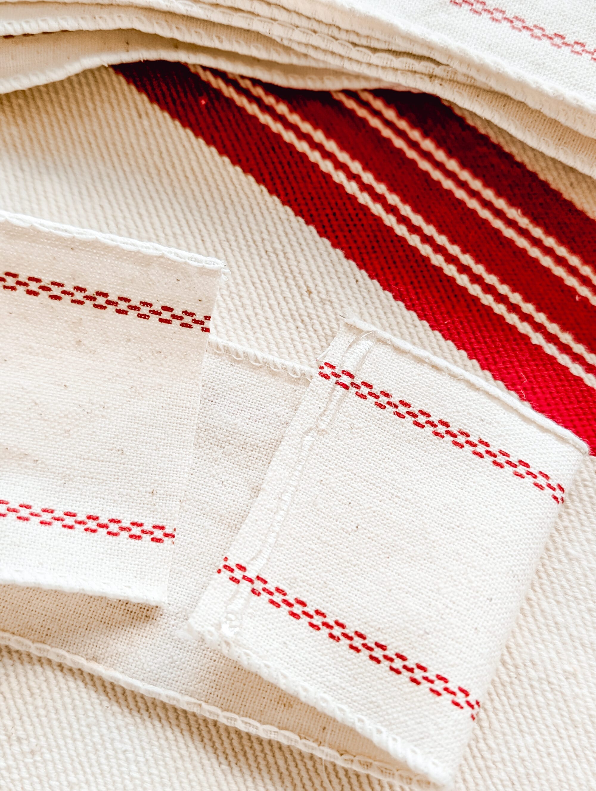 line of hot glue on the end of a cut piece of ribbon