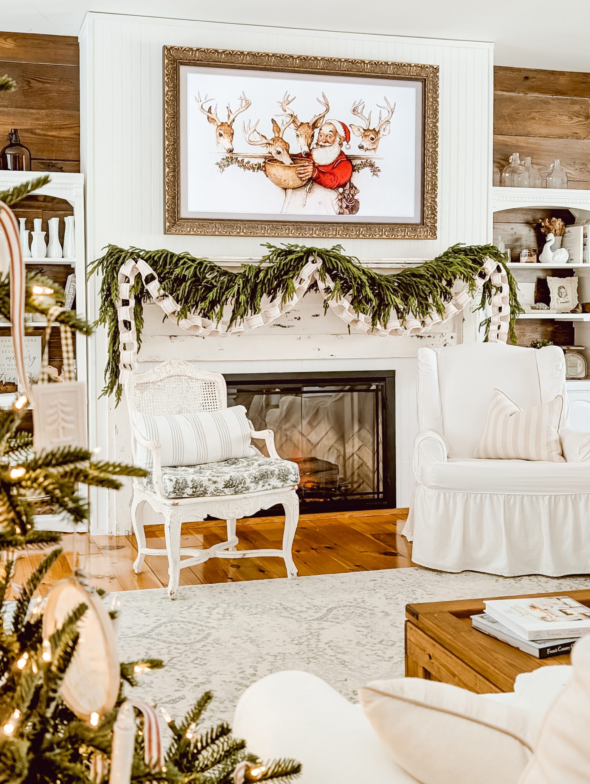 simple DIY ribbon chain garland layered with norfolk pine garland on an white farmhouse living room fireplace