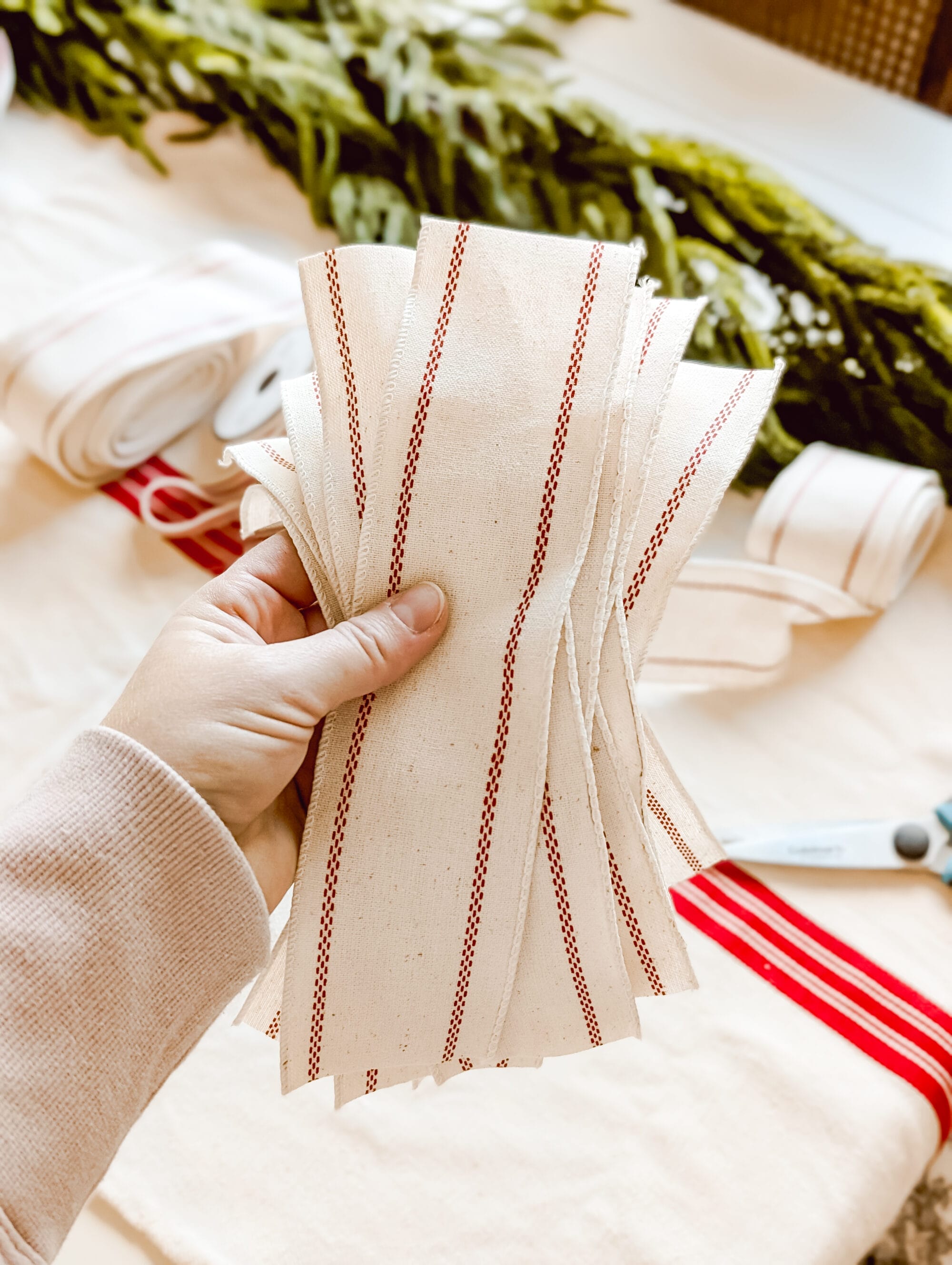 stack of cut up pieces of grainsack striped ribbon