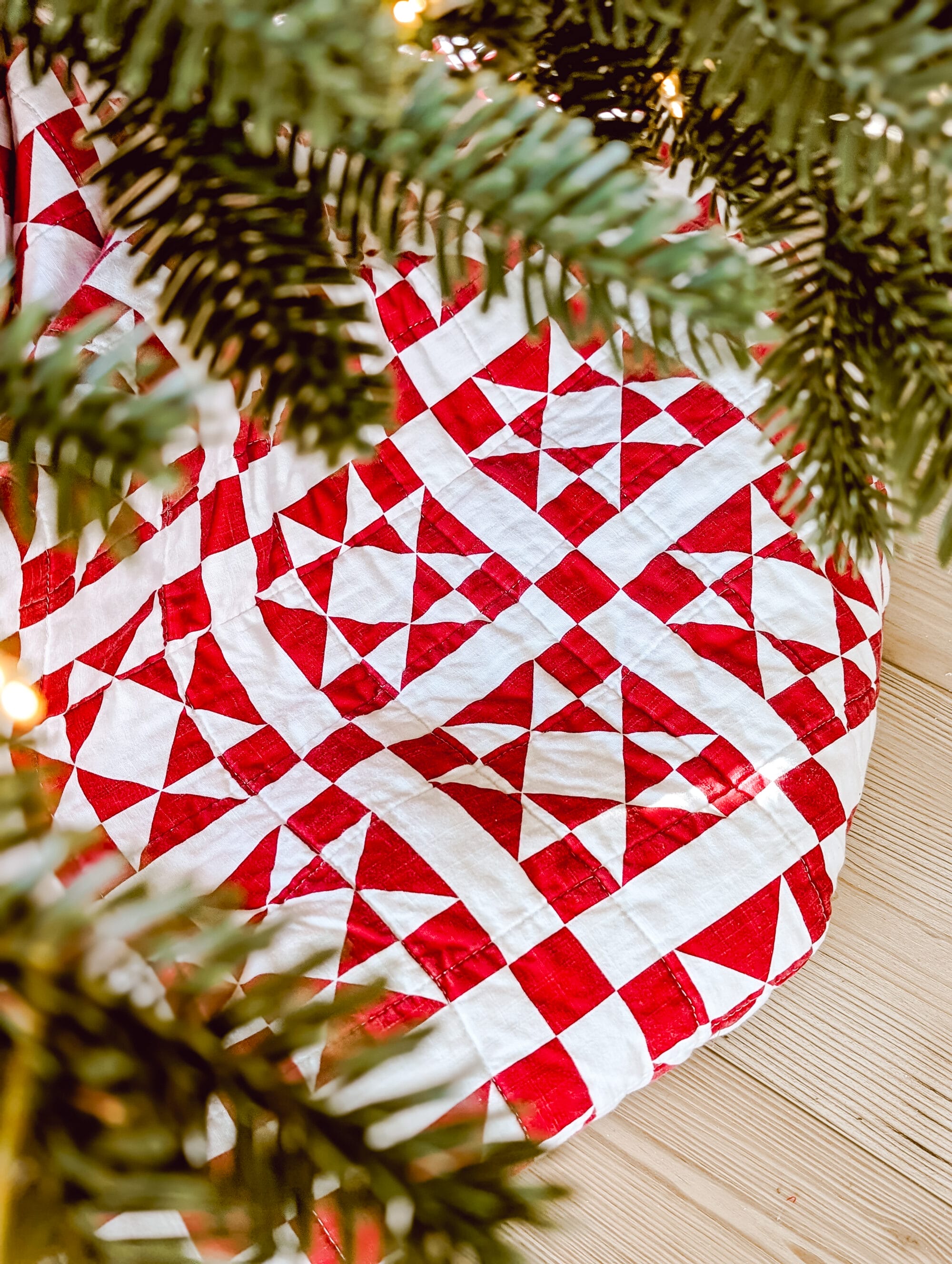 red and white Calvin Klein Abigail quilt as a Christmas tree skirt
