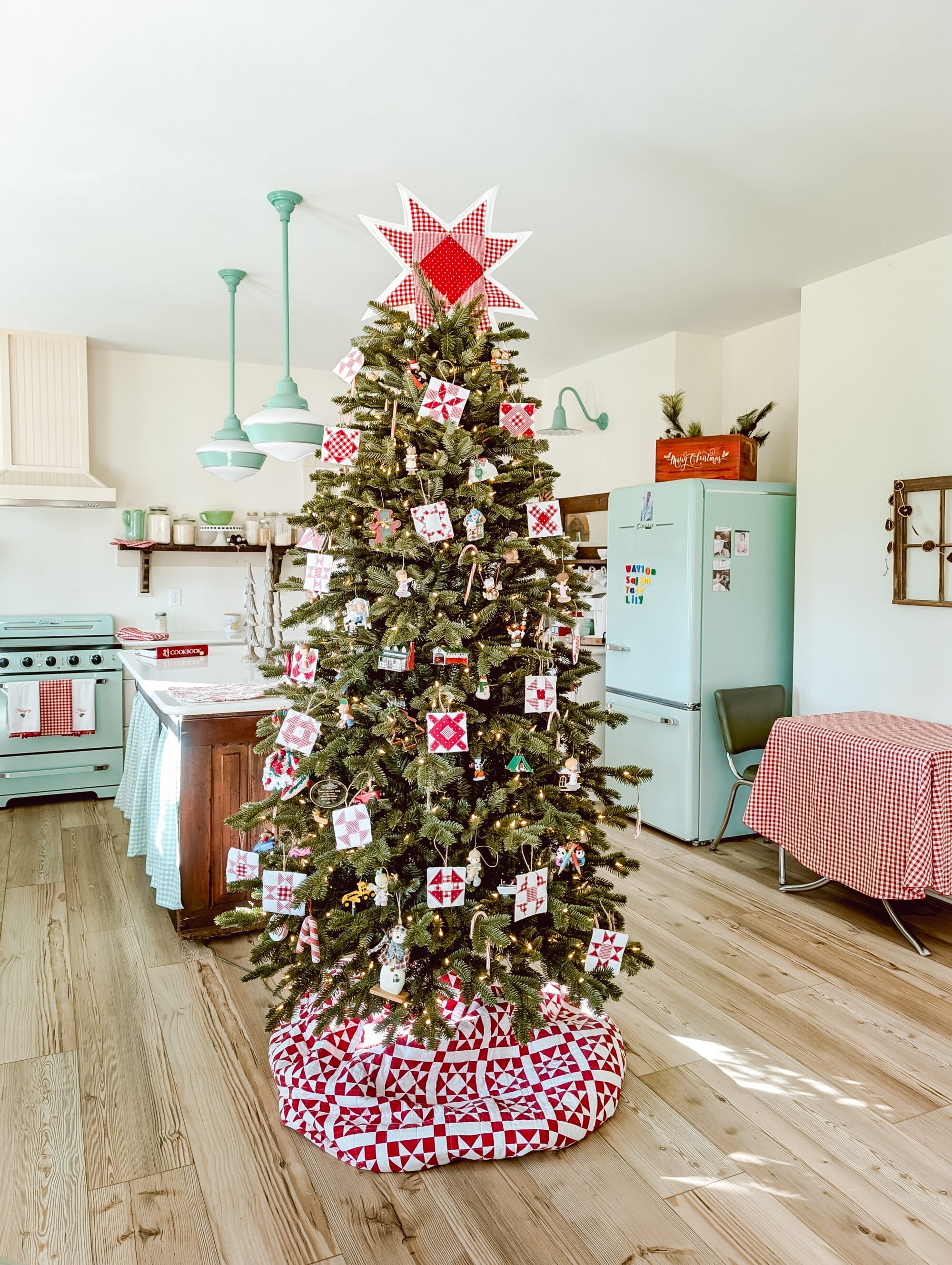Balsam Hill's Fraser Fir Flip Tree with red and white quilt block ornaments and a red and white quilt star tree topper in a vintage cottage kitchen